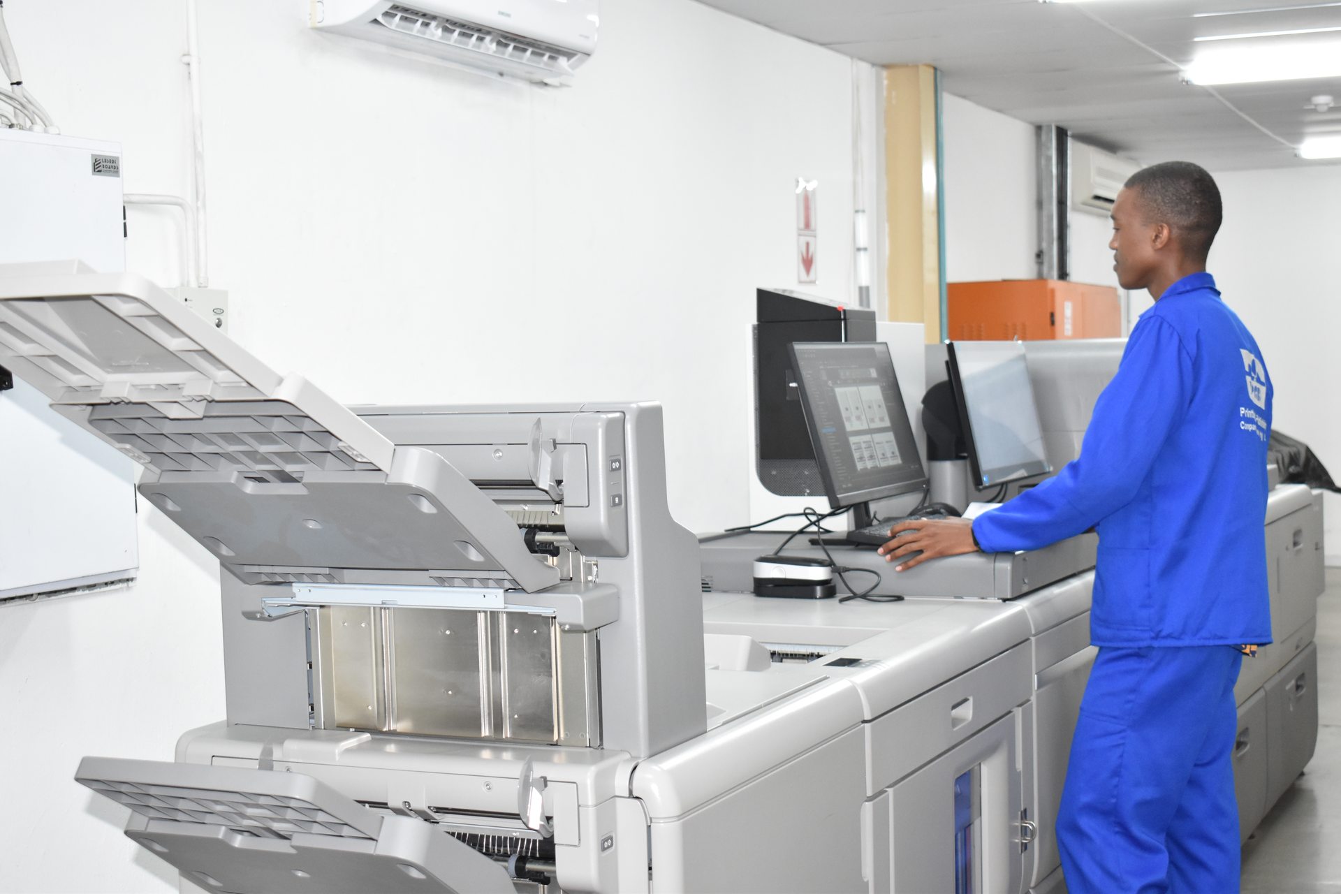 Staff monitoring digital print output