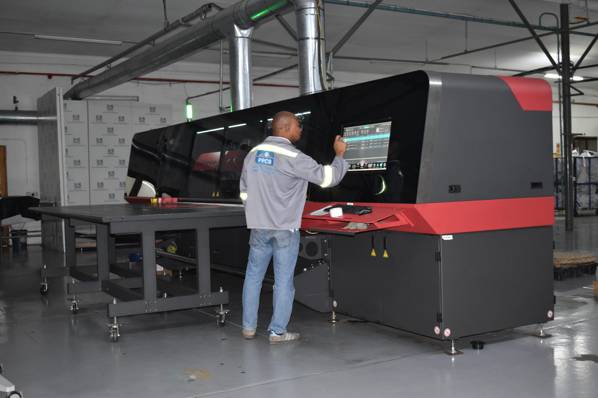 Operator setting up a large-format print job