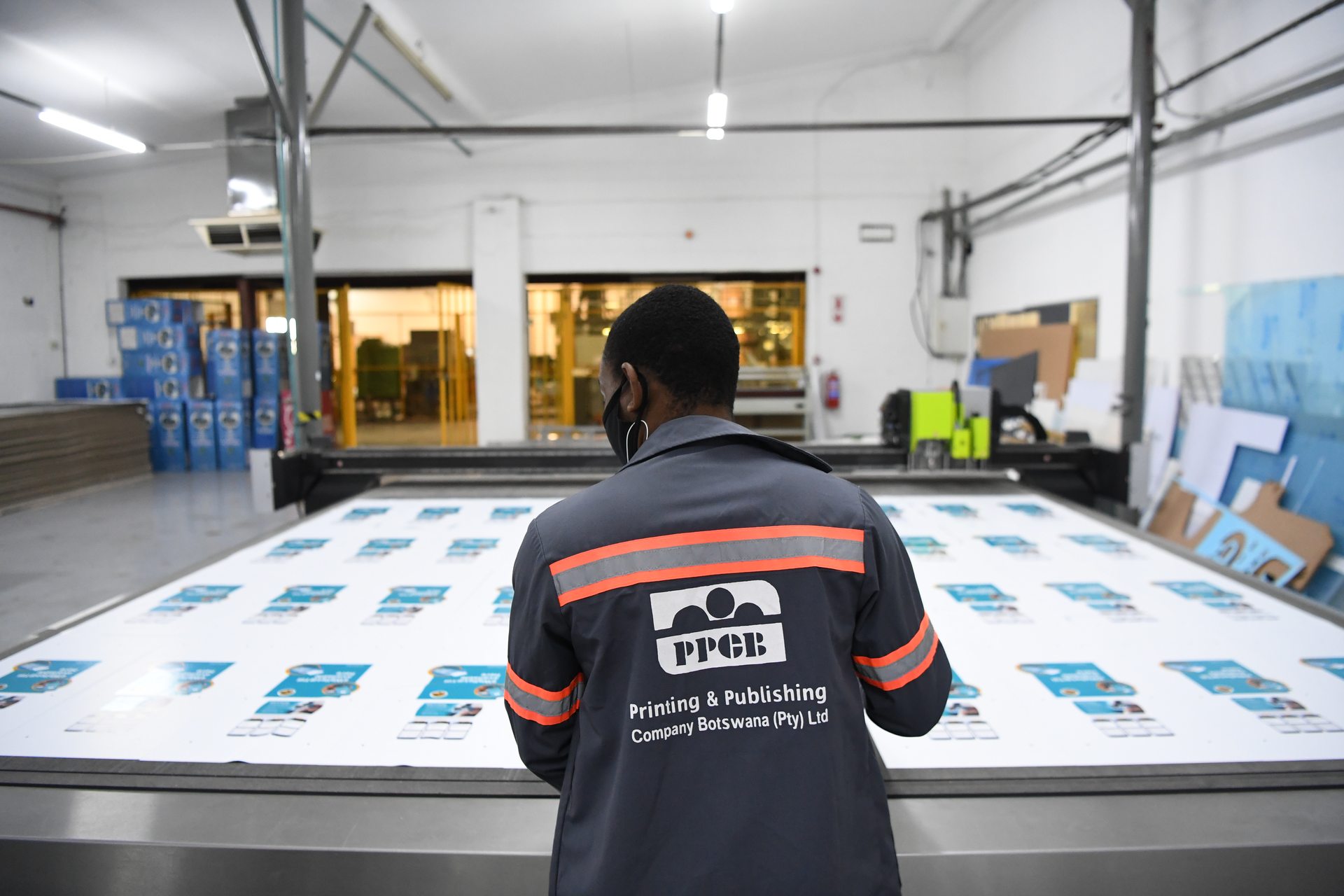 Staff member inspecting large-format print output