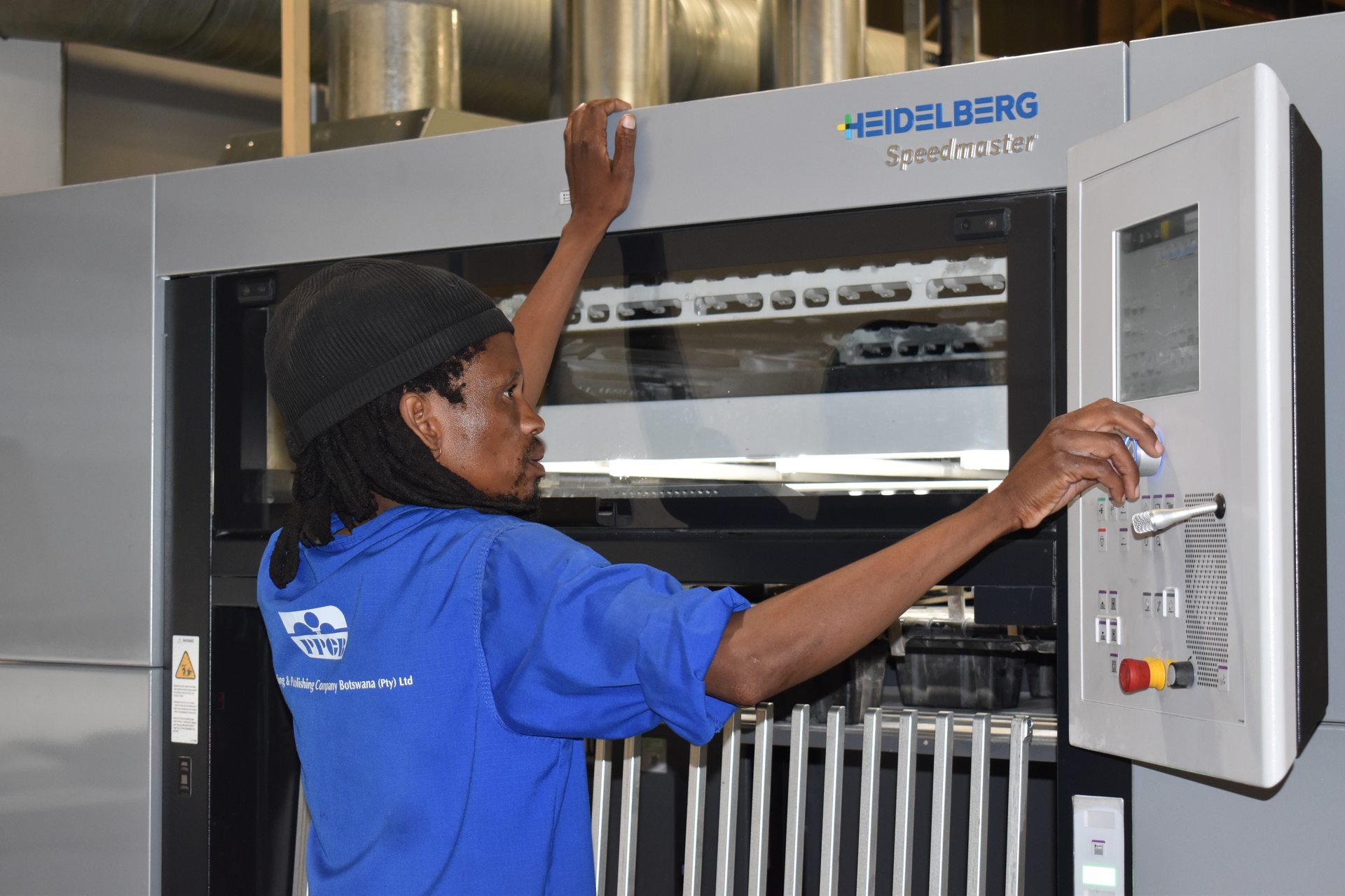 Operator loading the offset press